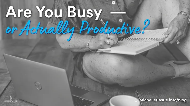 Black-and-white image of Michelle sitting and writing in a journal beside a laptop, overlaid with text: Are You Busy or Actually Productive?